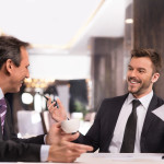 Businessmen having a conversation at a table