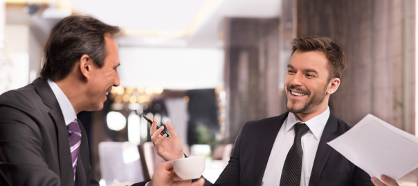 Businessmen having a conversation at a table